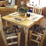 Table with Chairs and Prints on them